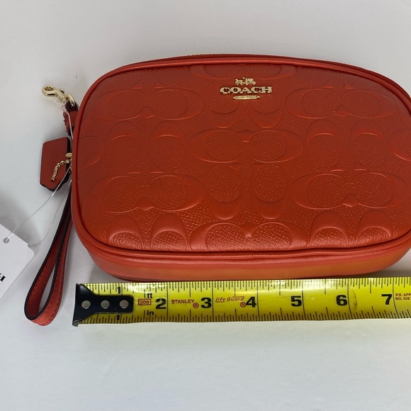 Coach camera bag with signature coated canvas detail. Shoulder/wrist strap.Coral - Picture 6 of 8